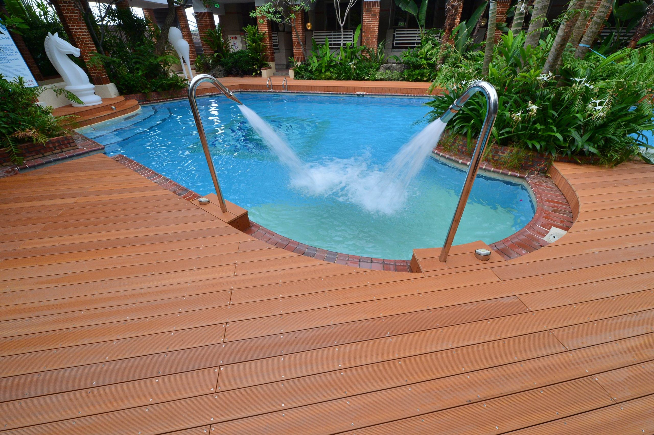 Wooden and brick poolside patio deck sealed with Waypoint Sealants